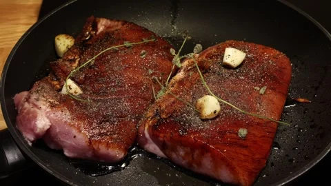 Pork in a fryingpan Stock Footage 296822365