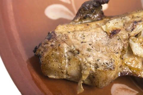Pork grilled on a bone. Stock Photos