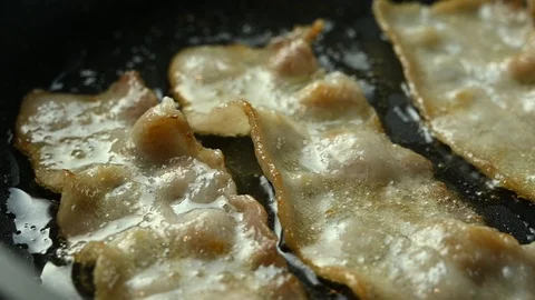 Pork ham fried in a pan Stock Footage 125928444
