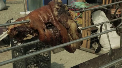 Pork ham roasted on an open fire Stock Footage 64260695