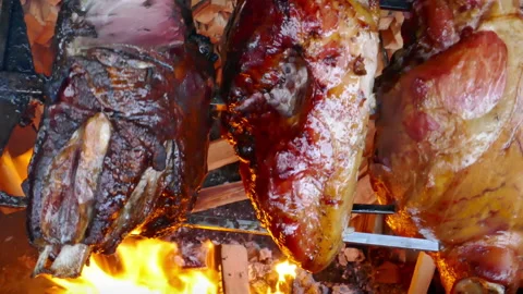 Pork hams roasted on fire Video stock 134700393