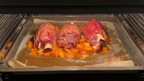 Pork knuckle baked on a baking sheet in the oven Stock Footage 290766525