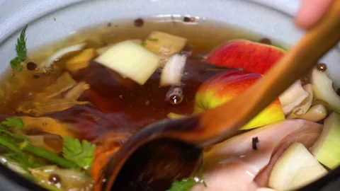 Pork knuckle instead of vegetables is cooked in a saucepan Stock Footage 249598653