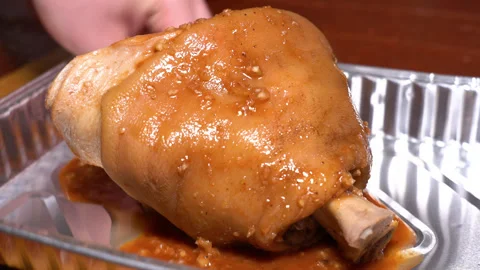 Pork knuckle rubbed with spices Stock Footage 249600637