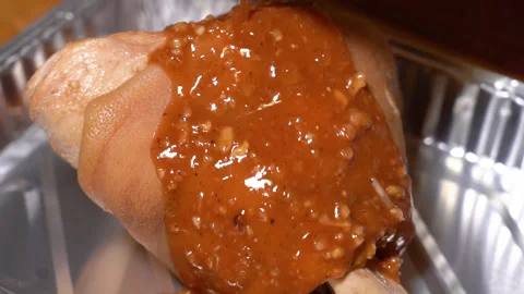 Pork knuckle, sauce falling on top Stock Footage 249599690