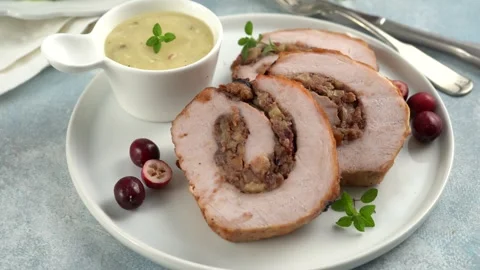 Pork loin roasted filled with cranberry bread stuffing Stock Footage 242526020
