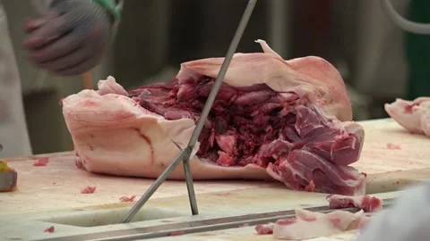 Pork meat being sliced into pieces Stock Footage 239690117