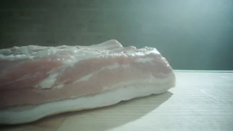 Pork meat falls on the table laowa lens Stock Footage 200937617
