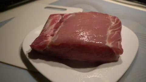 Pork meat on a plate Video stock 143109676