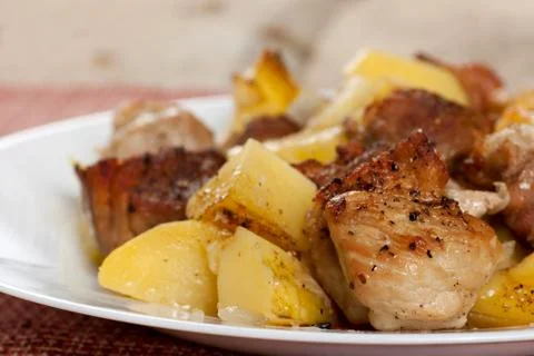 Pork meat with potatoes Stock Photos
