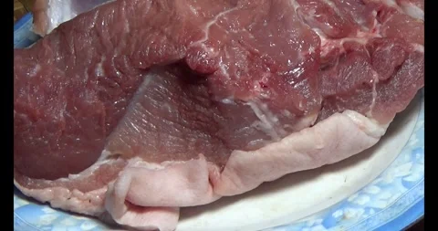 Pork on a plate Video stock 295571268