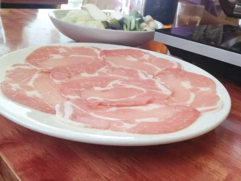 Pork on plates Stock Photos