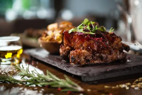 Pork ribs cooked at low temperature. Blackcurrant sauce, parsnip chips with Stock Photos