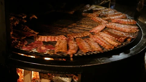 Pork ribs grill roasted on a rotating grill. fried pork. street food Stock Footage 94367809