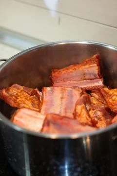 Pork ribs marinating in pot preparing for cooking Stock Photos