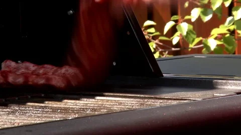 Pork Ribs put on the BBQ Stock Footage 85315413