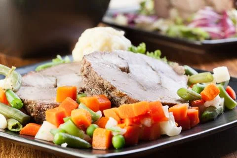 Pork roast with vegetable. selective focus. Stock Photos