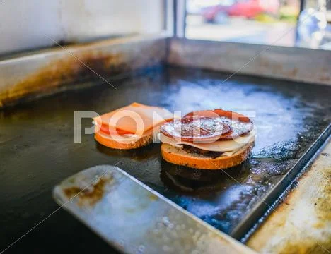 Pork Roll Sandwich Cooking On Catering Van Griddle
