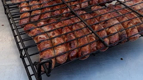 Pork sausages on a grill Stock Footage 131680701