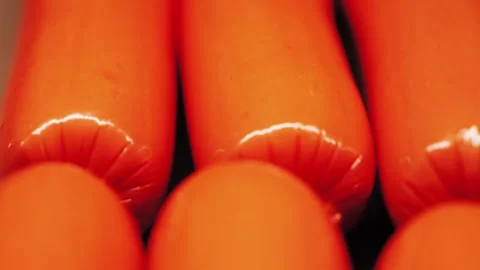 Pork sausages wrapped in plastic or mica. Close up of semi-finished meat Stock Footage 335806981