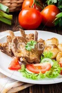Pork spareribs served with silesian noodles and sauce. Selective focus Stock Photos