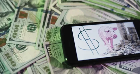 Pork Spending Image on iphone surrounded by $100 Bills. Stock Footage 169007040