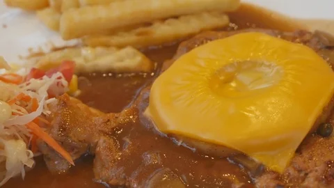 Pork steak and Deep Fried Dolly Fish Steak with French fries and Vegetables Video stock 78137993