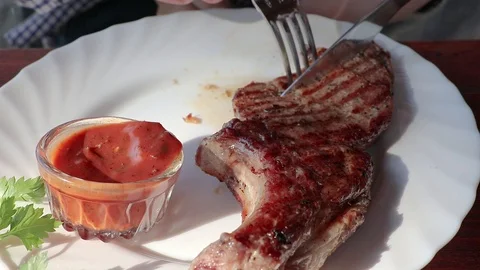 Pork steak on the bone with sauce Stock Footage 89877155