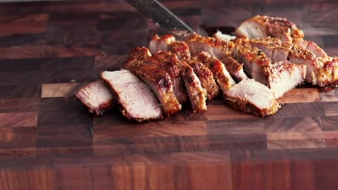 The pork steak is cut with a knife Stock Footage 261068523