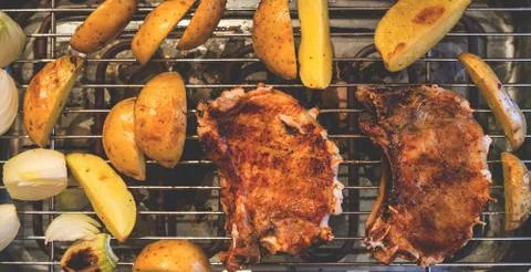 Pork steak on grill Stock Photos