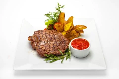 Pork steak with potatoes Stock Photos