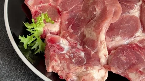 Pork steak raw meat lunch or dinner tasty snack fresh and delicious gourmet food Stock Footage 336679917