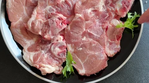 Pork steak raw meat lunch or dinner tasty snack fresh and delicious gourmet food Stock Footage 336679927