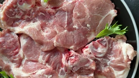 Pork steak raw meat lunch or dinner tasty snack fresh and delicious gourmet food Stock Footage 336679931