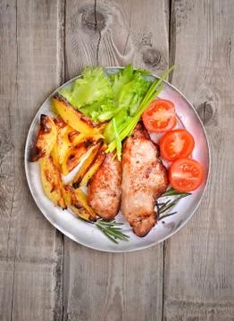 Pork steaks on rustic table, top view Stock Photos