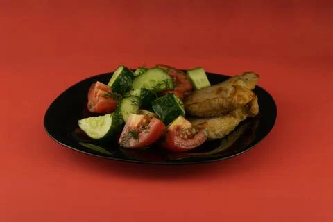 Pork steaks with vegetables Stock Photos