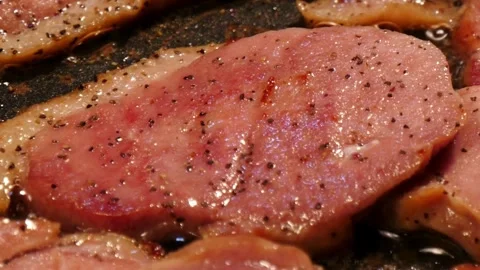 Pork stripes being prepared for breakfast at home kitchen. 스톡 동영상 334641807