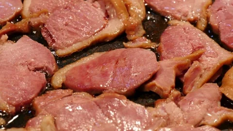 Pork stripes being prepared for breakfast at home kitchen. 스톡 동영상 334641931