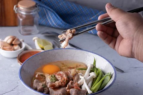 Pork Suki with Egg in Ceramic Cup Stock Photos