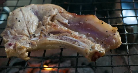 Porkchop grilled with smoke close up Stock Footage 229934704