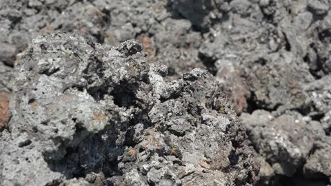Porous basalt rock texture in closeup, spongy volcanic stone surface background Stock Footage 339487229