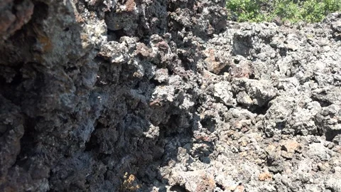 Porous basalt rock texture in closeup, spongy volcanic stone surface - Eruption Stock Footage 339505571