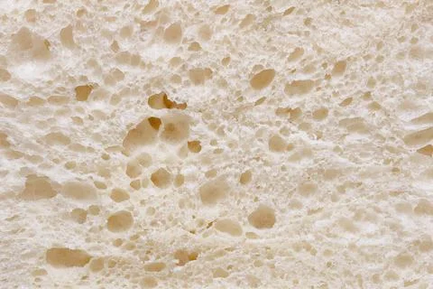 Porous pattern of white soft bread crump Stock Photos