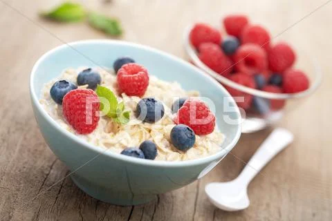 Porridge with fresh berries Stock Photos