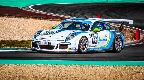 Porsche Cayman driven by racing driver Torsten Klimmer Stock Photos