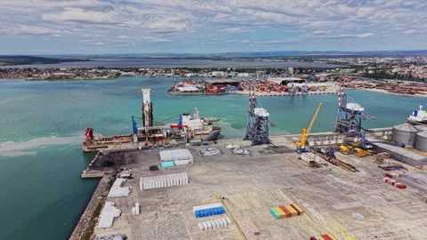 Port area shows busy docks and cargo ships in action Stock Footage 338327500