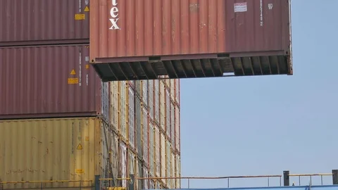 Port crane lifting container and from ship with cargo 4k for shipping business Stock Footage 115936761