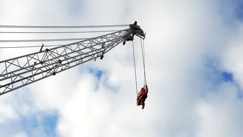 Port Crane Lifting Load Against Cloudy Sky Industrial Scene Stock Footage 332558340
