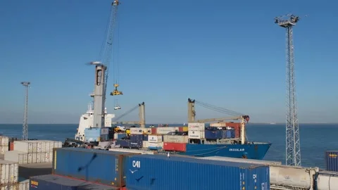 Port crane loading container ship with containers and cars in port Video stock 274853853