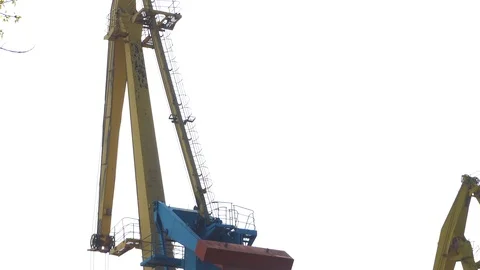Port Crane Loads Coal to the Bulk Carrier. The port marine crane unloads coal Stock Footage 106947062